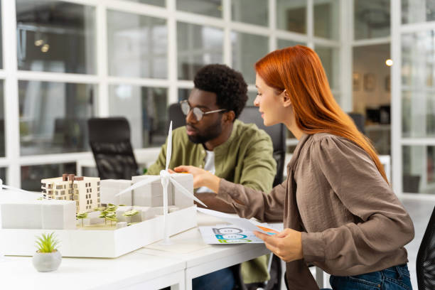 istock Two young architects working together on a new sustainable project 2187723043