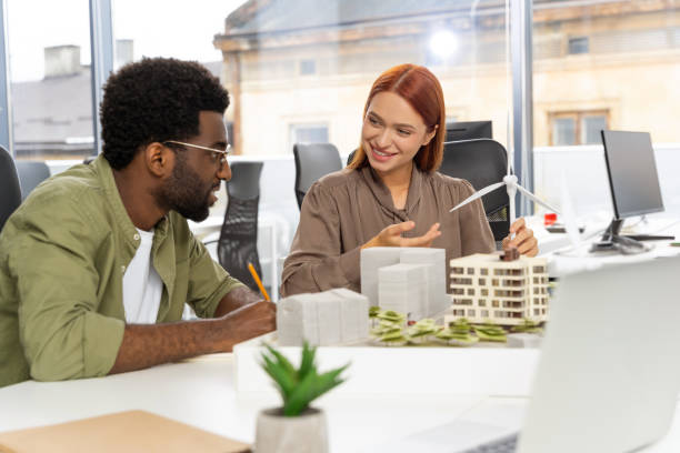 istock Colleagues working in the office and developing a new sustainable project 2187723046