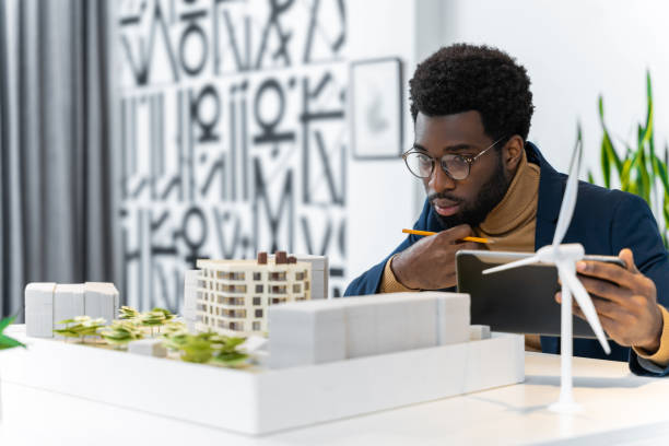 istock African american architect working on a wind farm project and looking involved 2187723252