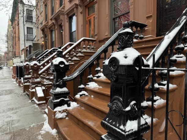 istock Row of historic Harlem brownstone stoops covered with snow 2187723484