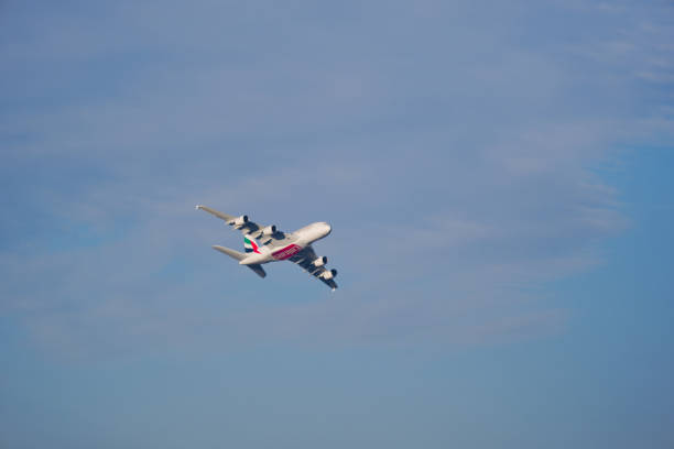 Flying airplane in the blue sky.