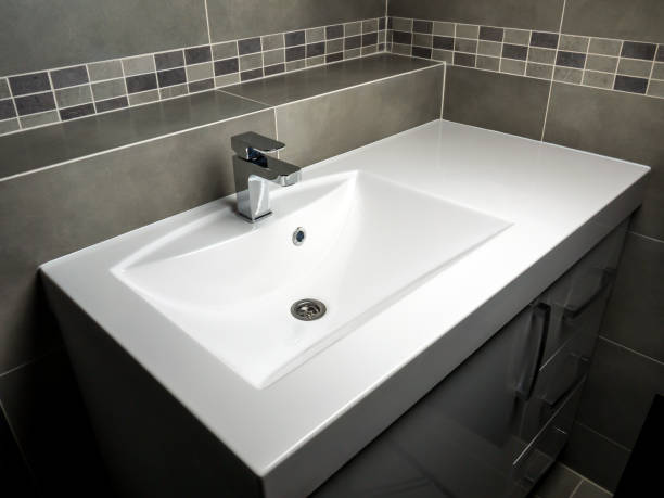 istock White washbasin with chrome faucet 2187726548