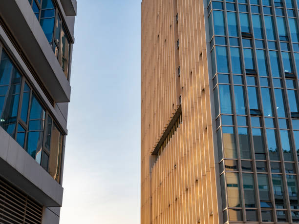 istock Sunlight shines on modern glass buildings 2187727784
