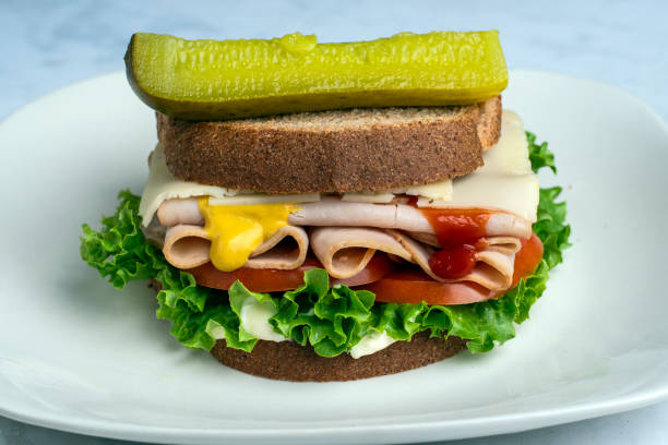 istock turkey  sandwich with  with tomato and lettuce 2187730295