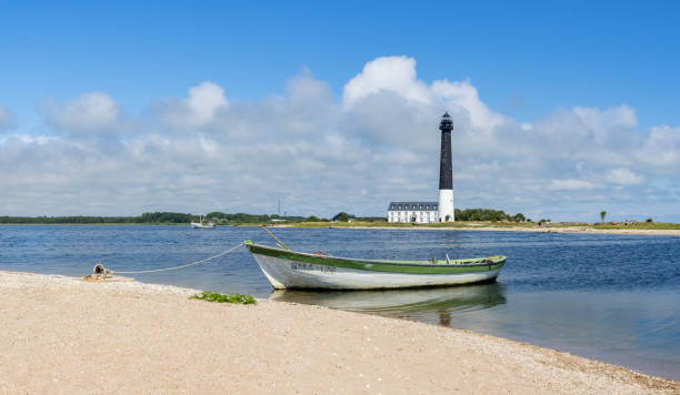 istock A small boat and a lighthouse in Saaremaa, Estonia 2187731277