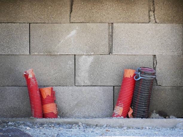 istock construction site with plastic tubes for cabels looking out of the ground 2187733377