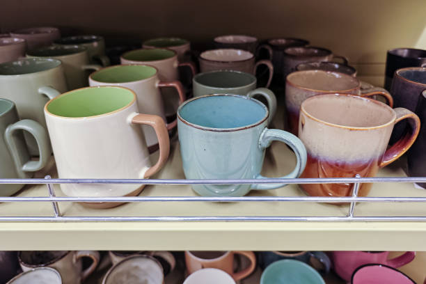 istock Collection of mugs displayed on shelves 2187736316