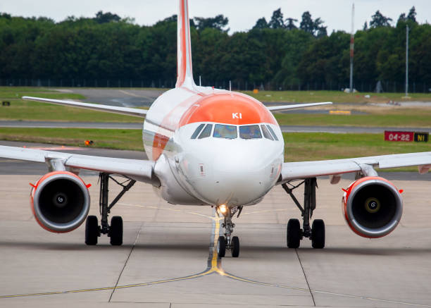 Dubrovnik, Croatia - 12 October, 2025: the orange empennage of an easyJet plane before departure on a sunny day in Dubrovnik.