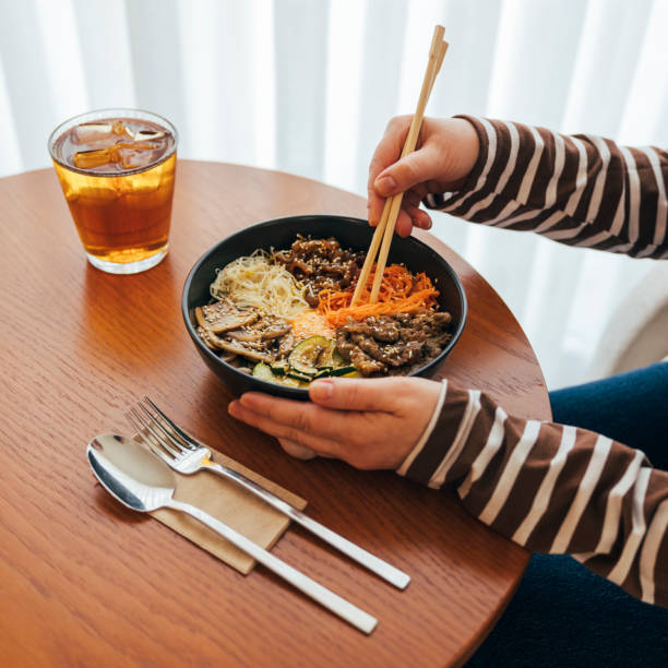 Close up, Woman eating bibimbap