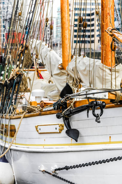 Close-up view of traditional wooden boats moored on calm lake water. Concept of maritime heritage, boating, and nautical lifestyle.