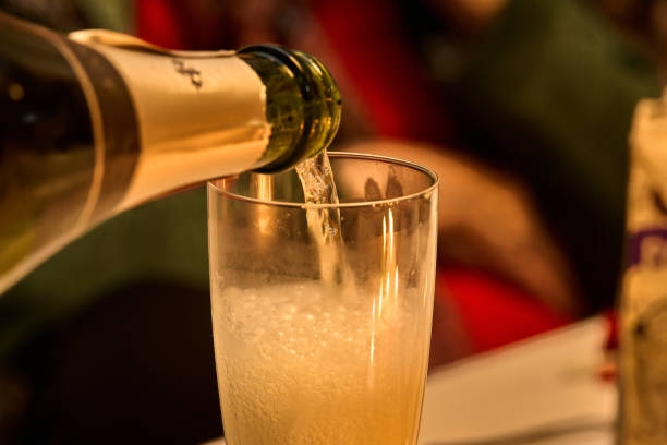istock Sparkling wine poured into a tall glass with soft lighting. 2187741622