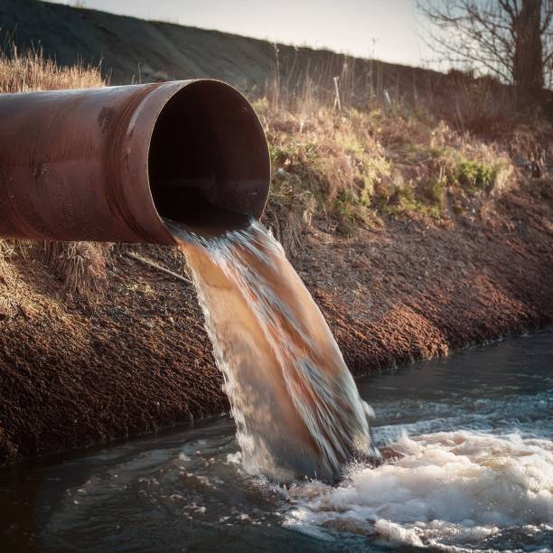 istock Sewage effluent flowing out of discharge pipe 2187741668