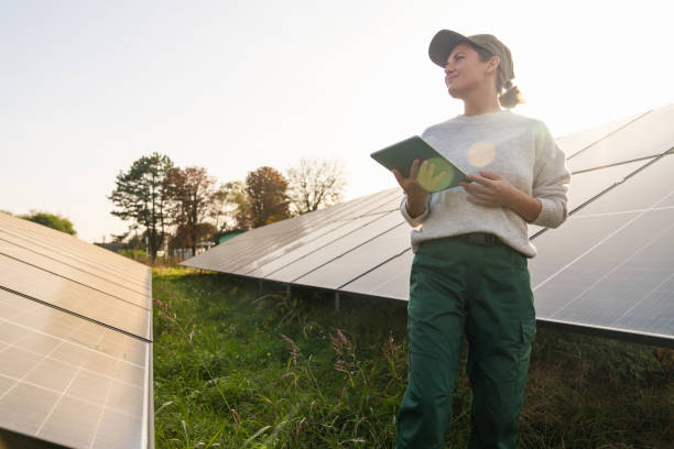 istock Female farmer with digital tablet on a modern farm using solar panels. 2187742396