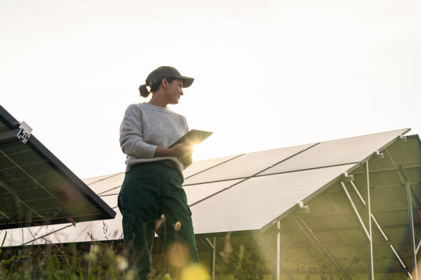 istock Female farmer with digital tablet on a modern farm using solar panels. 2187742609