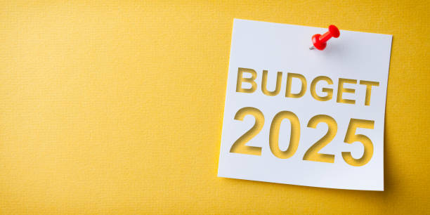 istock Budget 2025 Word in White Sticky Note on Yellow Chardboard Background 2187742706