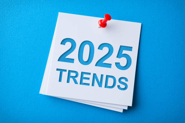 istock Trends 2025 Word in White Sticky Note on Blue Cardboard Background 2187742817