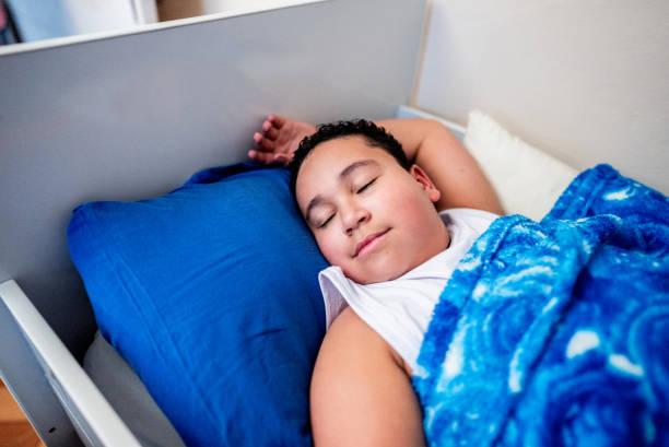 Child boy sleeping in the room