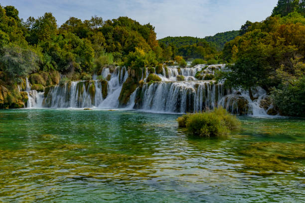 istock Beautiful view of the waterfalls covered in a dense forest 2187745172