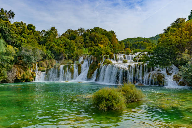 istock Beautiful view of the waterfalls covered in a dense forest 2187745185