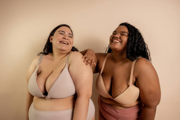 istock Happy women in beige background at studio shot 2187747894