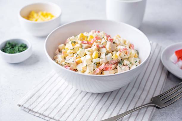 istock Imitation crab meat corn cucumber salad in a bowl 2187751053
