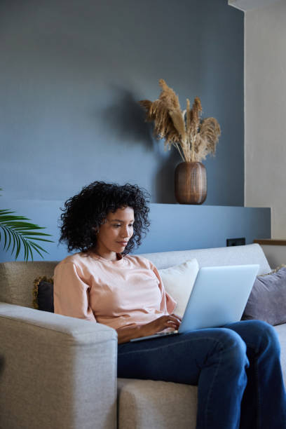 istock Latin woman working from home on laptop computer 2187751858
