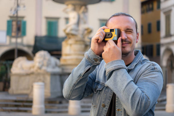 istock Tourist photographer shooting disposable camera 2187754868