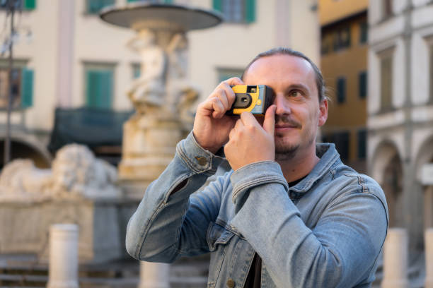 istock Tourist photographer shooting disposable camera 2187754880