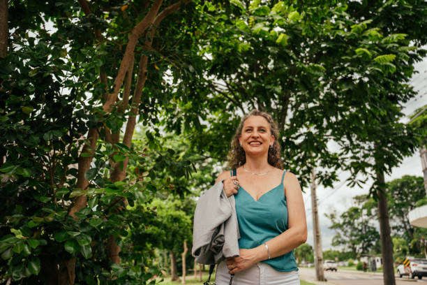 istock Woman walking through green areas to work 2187756025
