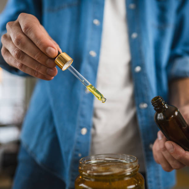 istock close up of man herbalist prepare natural oils in a rustic workshop 2187756752