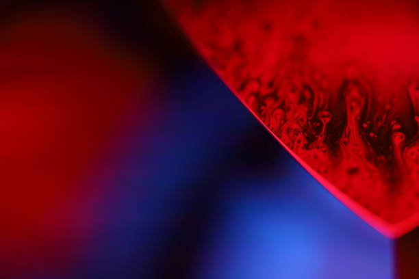 istock Red and purple fluid forms, liquid abstraction, colour waves, deep dark backgrounds 2187757595