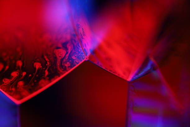 istock Purple liquid surface in the darkness, bright fluid background, smooth movement 2187757604