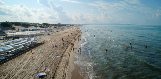 istock Beach with people and umbrellas 2187758999
