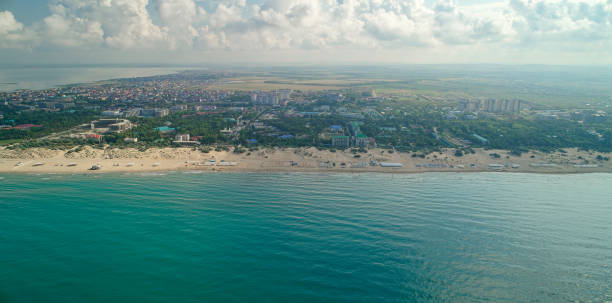 istock Beautiful beach with a city in the background 2187759023