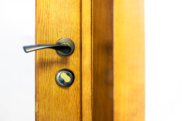 istock wooden stylish door with a metal modern handle 2187759461