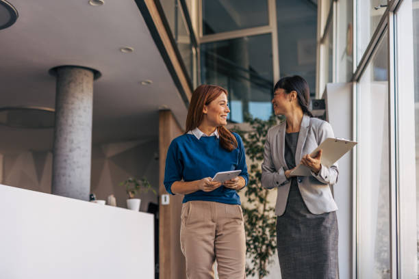 istock Business partners walking together and talking 2187761258