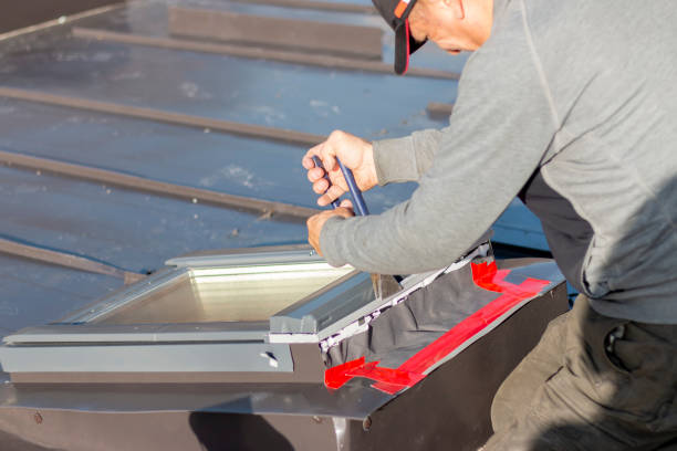 istock A roofer builder worker finishing folding a metal sheet using special pliers with a large flat grip. 2187763380
