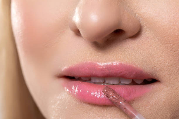 istock This image features a closeup of glossy lip application with a blurred background 2187769175
