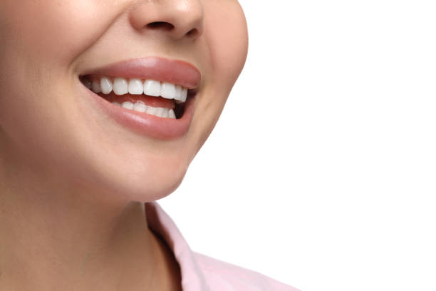 istock Woman with clean teeth smiling on white background, closeup 2187774104
