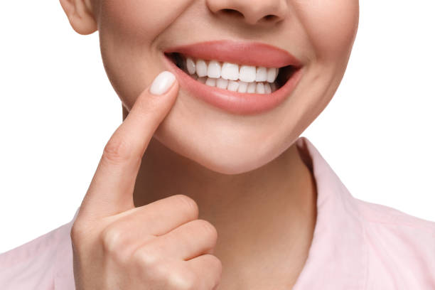 istock Woman showing her clean teeth and smiling on white background, closeup 2187774152