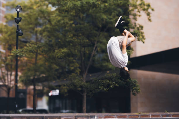 Teenage parkour athlete in urban location
