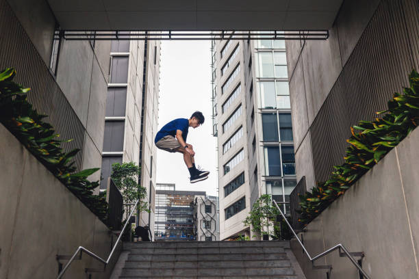 Teenage parkour athlete in urban location