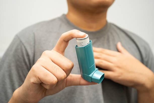 istock Asthma and chronic obstructive pulmonary disease COPD, Asian young man using metered dose inhaler MDI. 2187782794