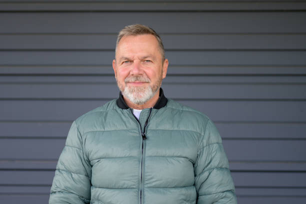 istock Mature Man with a Gentle Smile in Green Jacket 2187783214