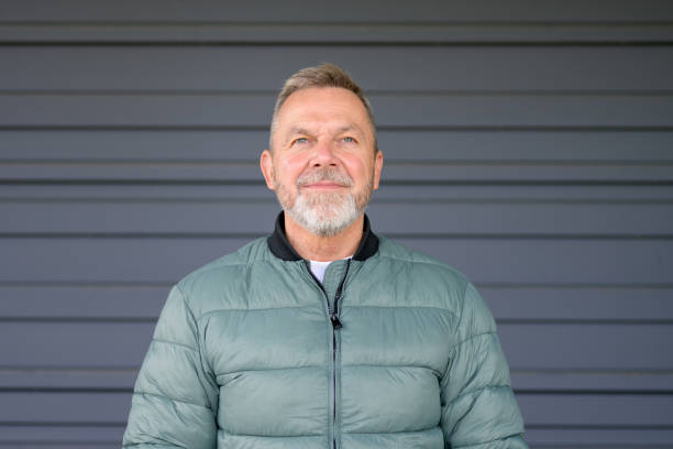 istock Mature Man with a Thoughtful Expression in a Green Jacket 2187783519