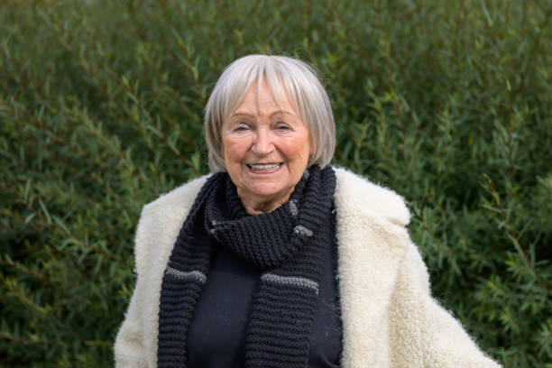 istock Elderly Woman Smiling Brightly in Nature 2187783659