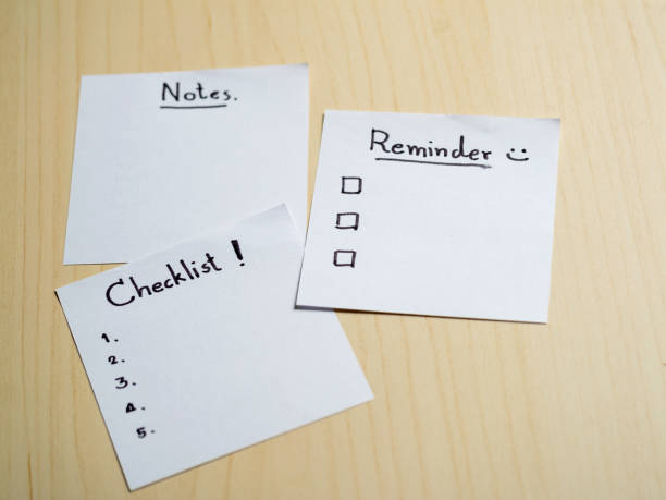 istock Organizing your life checklist notes and reminders on a wooden table home office conceptual view 2187785532