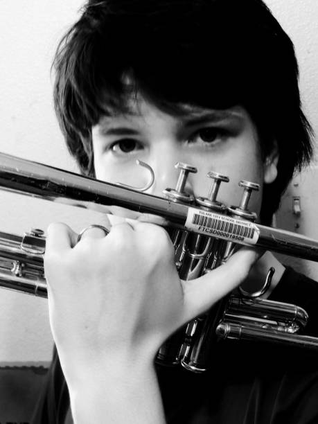 Teen boy trumpet player close up