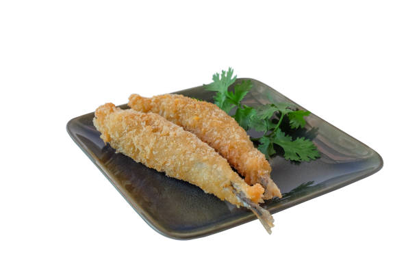 Shishamo fried, deep fried fish capelin  in dish on white.