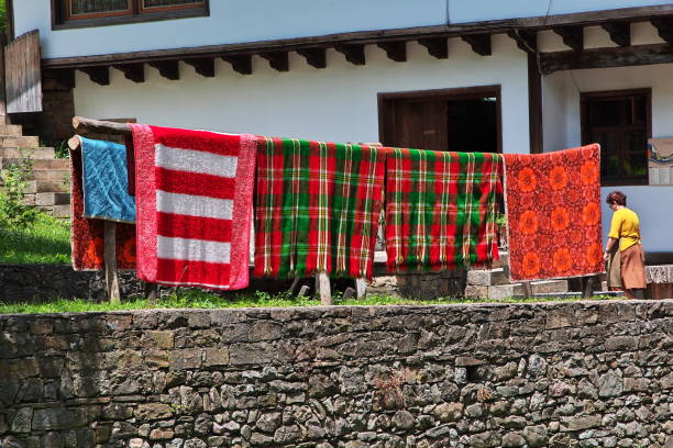 Two senior Peruvian women wearing a national clothing, Chivay, Peru. Chivay is a town in the Colca valley, capital of the Caylloma province in the Arequipa region, Peru. Located at about 12,000 ft above sea level, it lies upstream of the renowned Colca Canyon. It has a central town square and an active market.